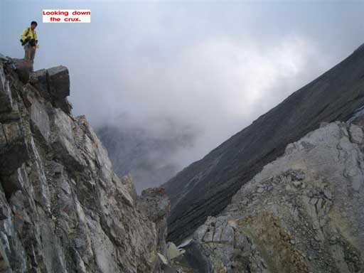 Me looking down at the first crux. Photo by Grant