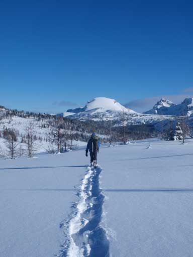 Ben slogging back, with Eagle Mountain behind