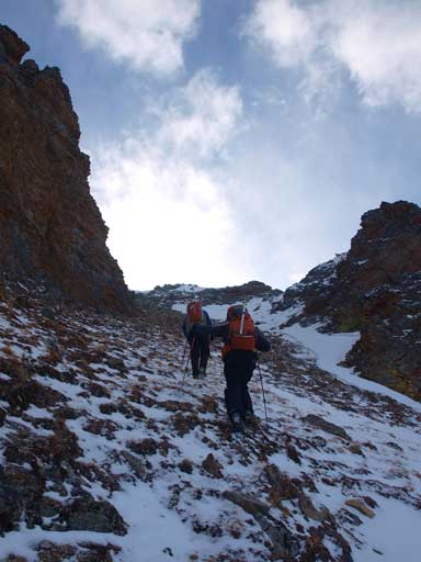 Mike and Andrea hiking through a rock gate
