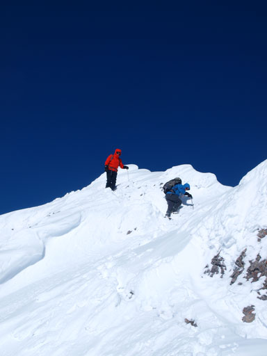 Continue descending the summit ridge