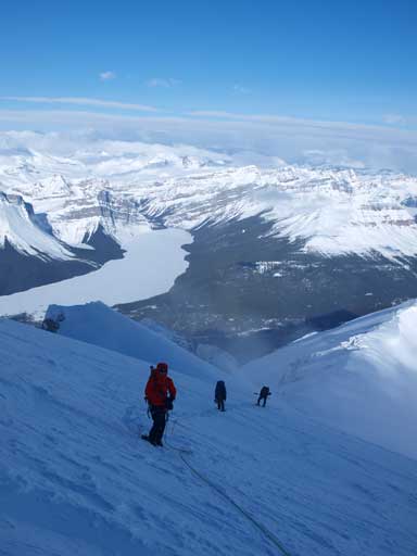 The terrain steepens near the summit block. Hector Lake in the background.