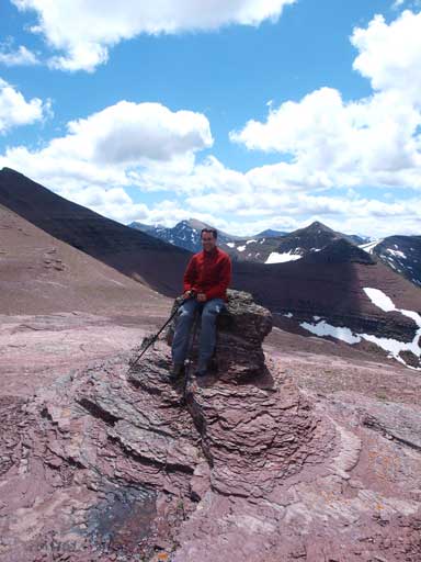 Eric sitting on a rock nipple, at Newman/Spionkop col.