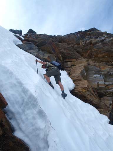 We eventually found a break through the cliff, and Eric took the lead, step-kicking up a steep couloir.
