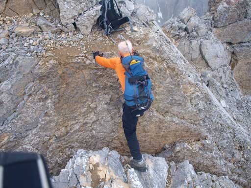Climbing back over the rock crevasse