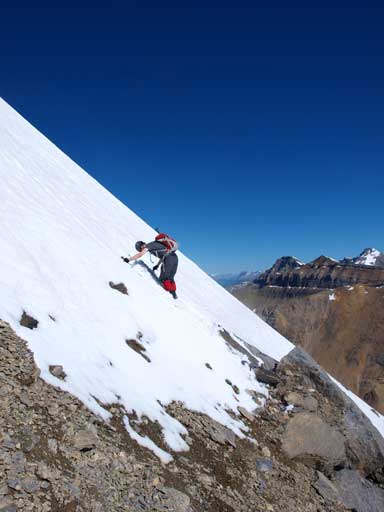 Mike traversing the steep exposed snow