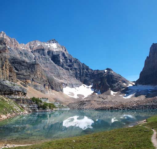 Hungabee Mountain looms behind Opabin Lake