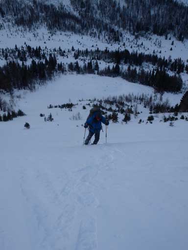 Ben snowshoeing up the steep avalanche slope