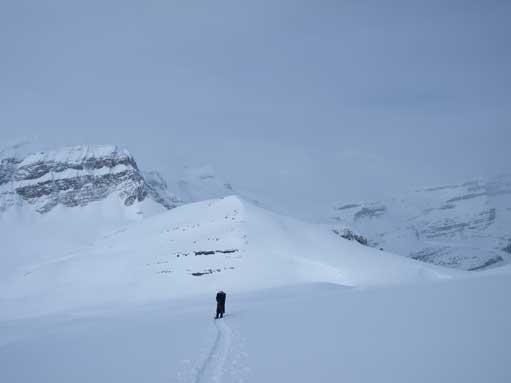 Mom following me up the upper slope, with Little Crowfoot being the small bump behind.