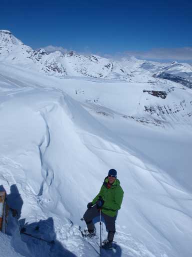 Vern approaching the summit, with big views behind