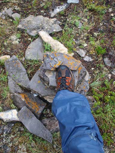 Me stepping on the smaller summit cairn