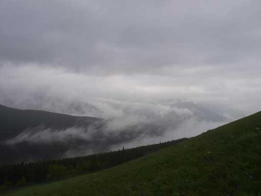 Broke through the first layer of clouds. I was above treeline at this point.