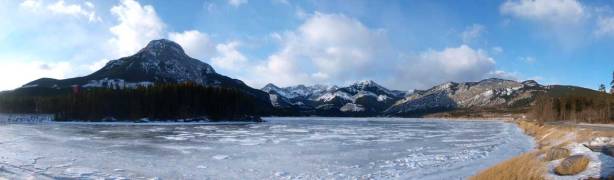 Panorama of the frozen Barrier Lake. Mount Baldy on left