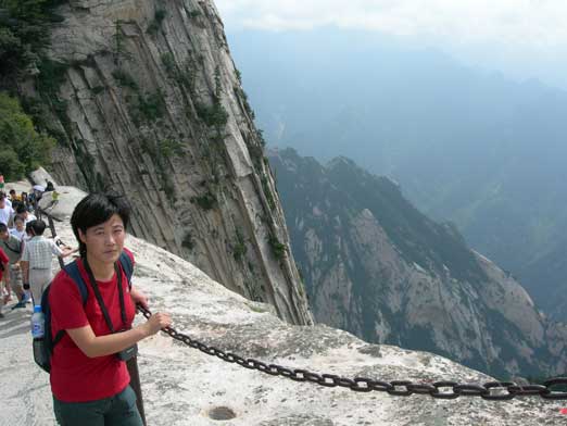 Mom with the south peak's vertical cliffs behind