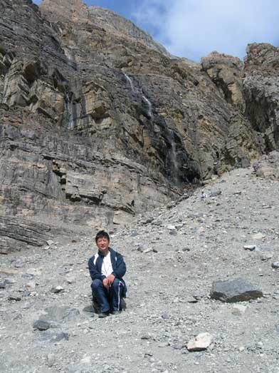 Dad sitting below a scree cone