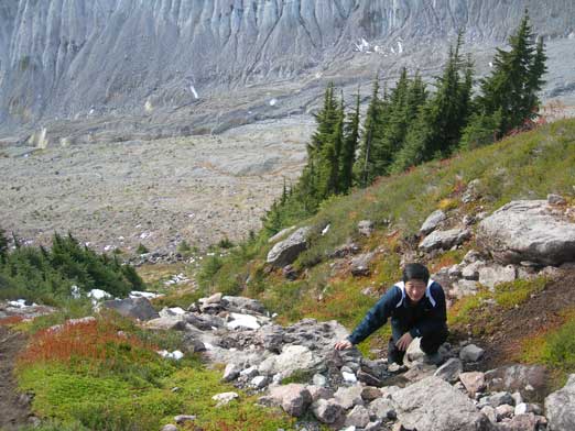 Dad scrambling up some off-trail terrain