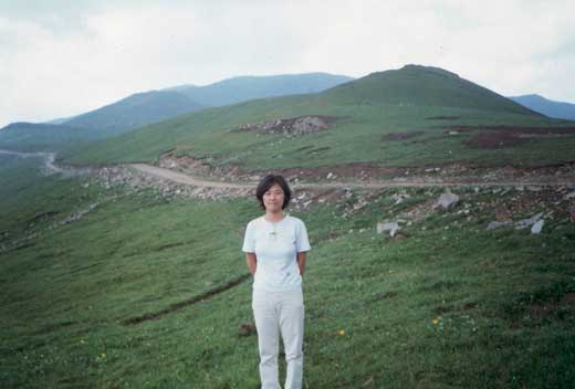 Mom with the mountain road behind.