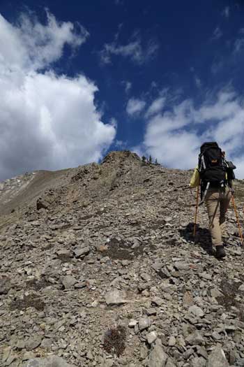 Me hiking up the typical terrain. Photo by Ben N
