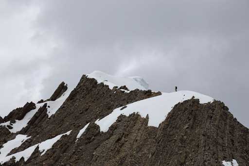 Me scrambling up towards false summit. Photo by Ben N
