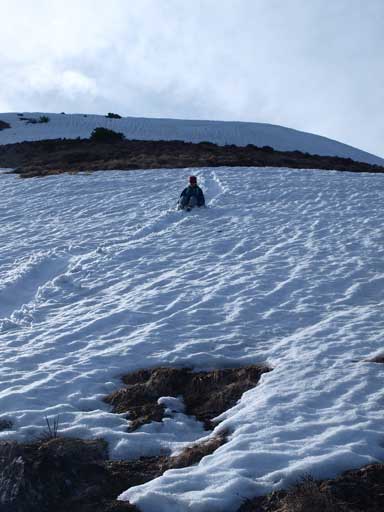 We glissade down the only bit of snow on our descent route