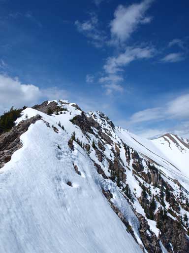 The mountain looks much more beautiful with snow and blue sky