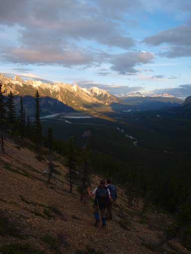 Hiking down the open slope with big views behind