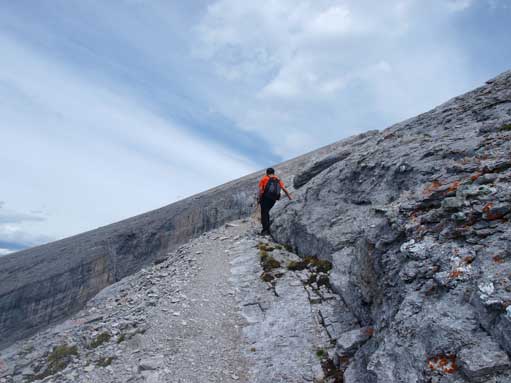 Dad scrambling up slabby terrain