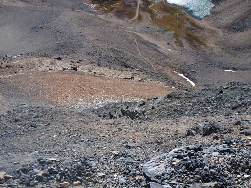 Descending steep and loose terrain from 2nd grey band, towards the 1st grey band which is at center of this photo.