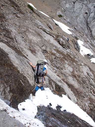 Ben crossing the wet ledge