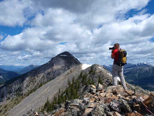 Vern taking photos, with the false summit in background