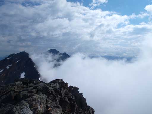 The low clouds. You can also see Pyramid Mountain's tip left of center