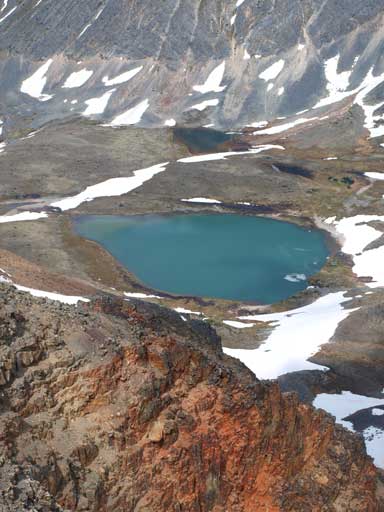 Another alpine tarn, and note the reddish/orange colour rocks