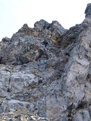 Neil down-climbing the steep terrain