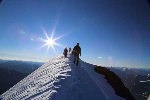 Descending the summit ridge. Photo by Ben N