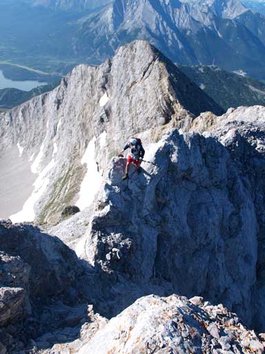 Grant crossing over to the dip. This shot gives a better perspective of the exposure of this crux