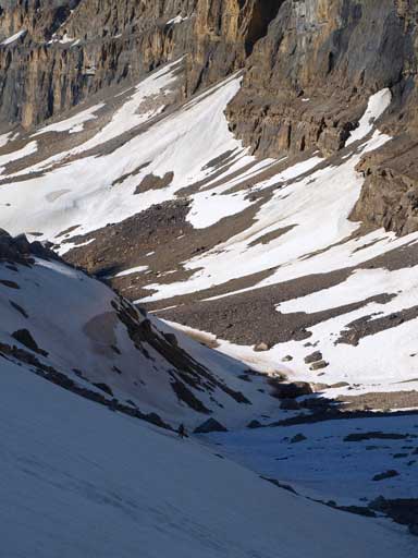 Looking down at Ben crossing a tricky icy slope without crampons.