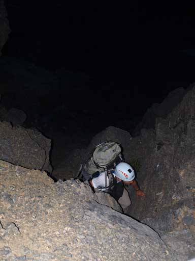 Ben scrambling up some difficult scrambling terrain. It's not as dark as it looks from this photo. 