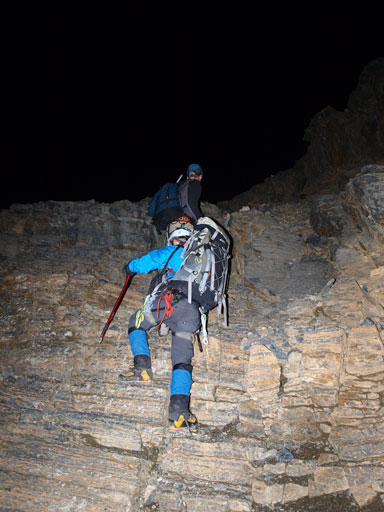 Ben scrambling up the head-wall in dark