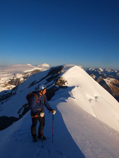 Grant going up the summit ridge. Silverhorn behind