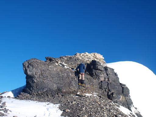 Ken scrambling up a rock step to get back to Silverhorn