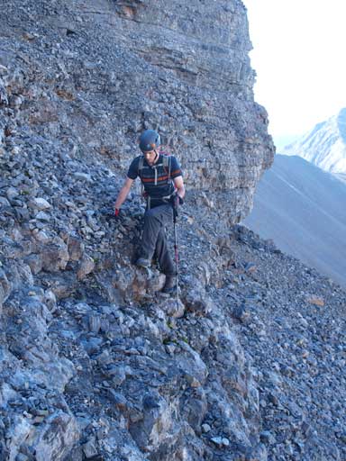 Mike on the typical typical terrain. Loose rubble on down-sloping ledges.
