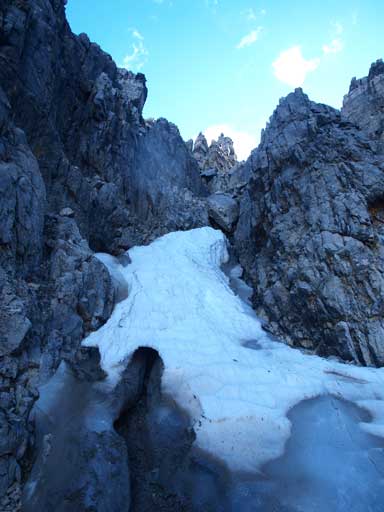 There's still a bit of snow and ice. We didn't need to ascend it though. Route goes up climber's right here.