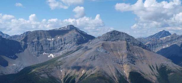 The big peak is unnamed. On the far right in the distance is Mount Rutherford