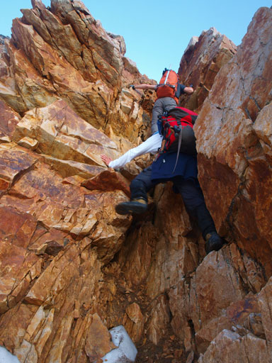 Mike and Grant scrambling up a difficult step