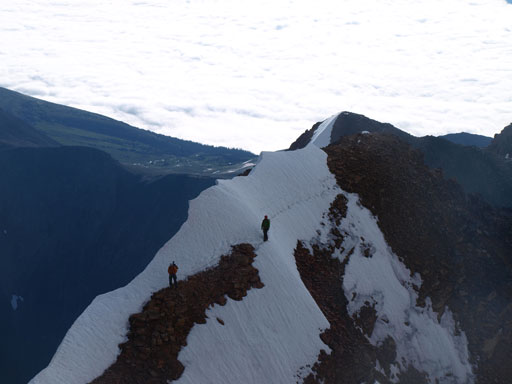 Looking back at the 3 Calgarians traversing the exposed snow