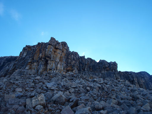 Looking up at the rock band that's marked as the crux