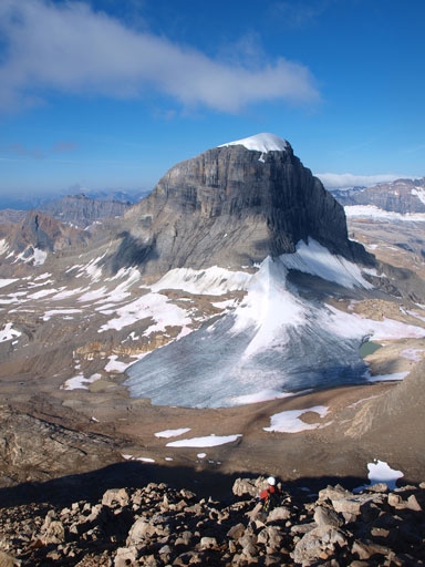 Rod coming up a boulder field, with Mount Niles behind