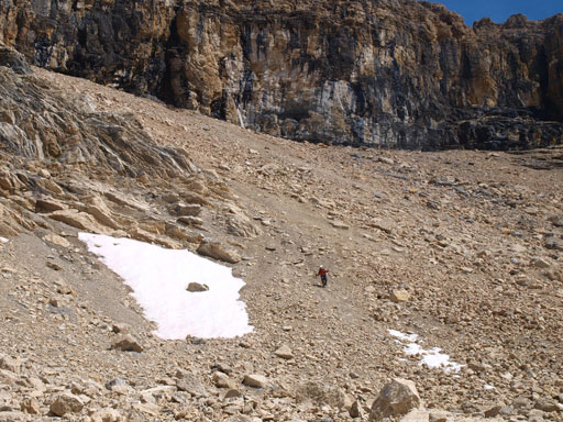 Rod descending hard scree that's more like steep moraine.. Painful.