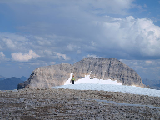 Dan coming to the summit of Strom, with Mount Magog behind