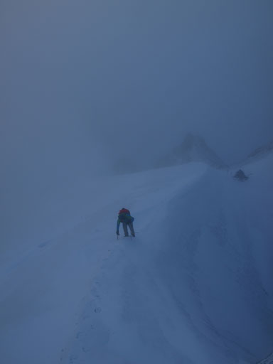 Vern climbing up a snow arete