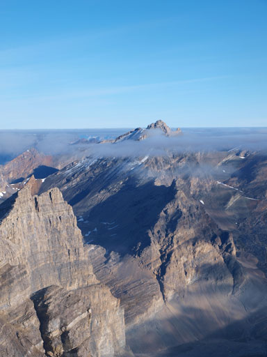 Clouds are lifting, revealing more of Recondite Peak